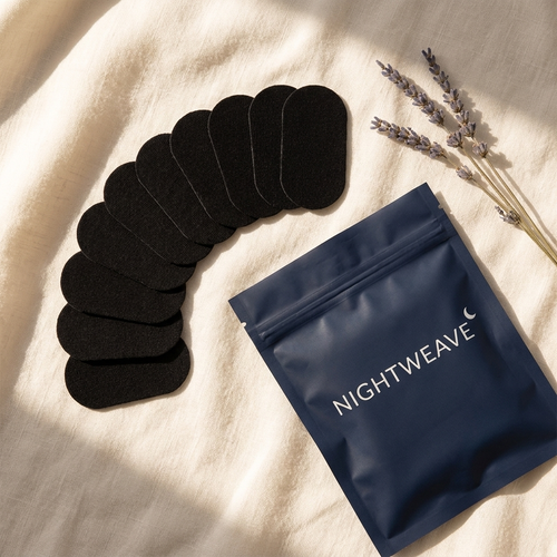 NIGHTWEAVE strips fanned out with open pouch on linen